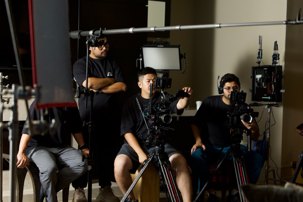 More Than Vision production team working with cameras, lighting and audio equipment on set